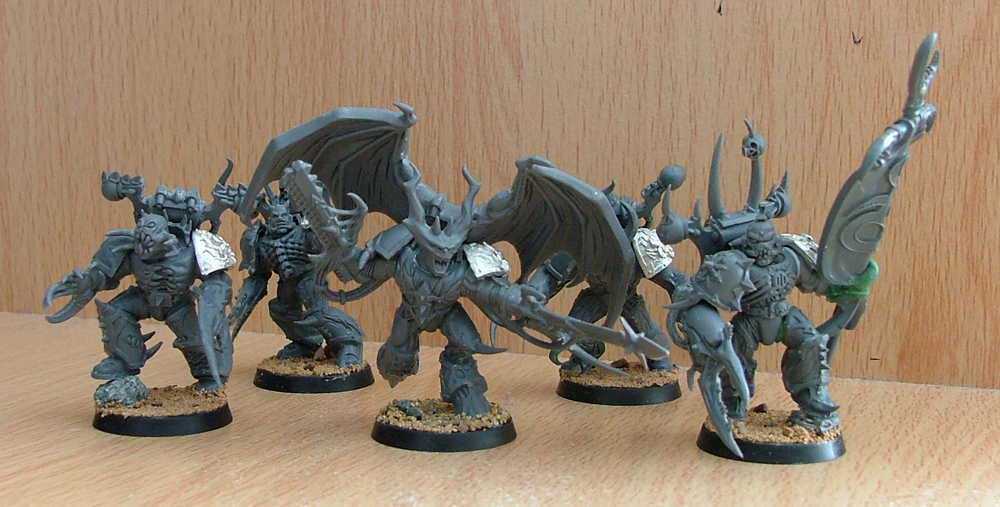 The Possessed Marines in this picture have been based with sand and stuck to their bases before being undercoated.